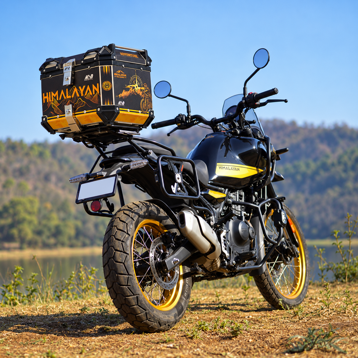 HMD 45L aluminium motorcycle top box with black and gold orange Himalayan adventure graphics mounted on a motorcycle