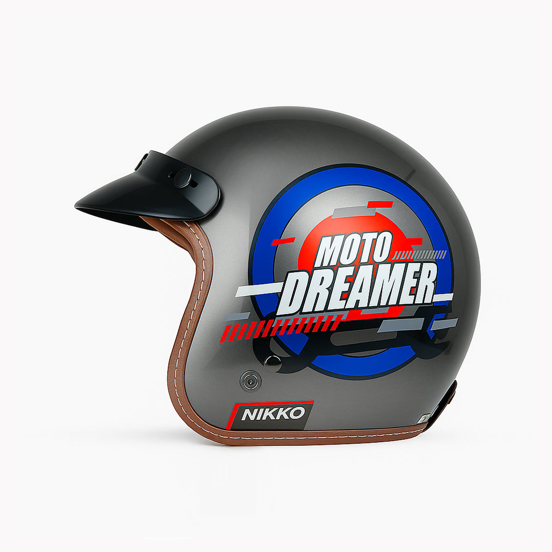 Gray motorcycle helmet with 'Moto Dreamer' design on a white background