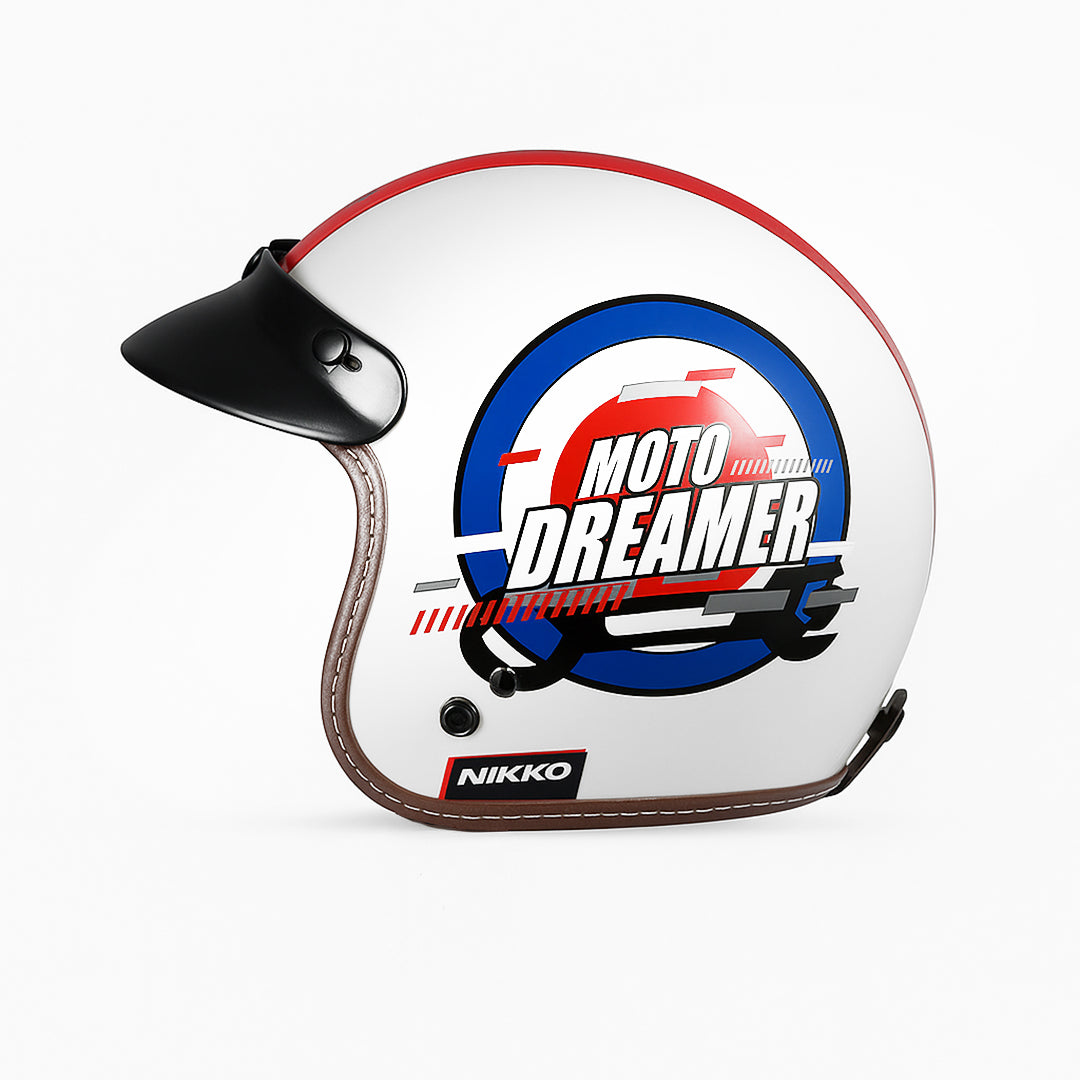 White motorcycle helmet with 'Moto Dreamer' design and Nikko branding on a white background